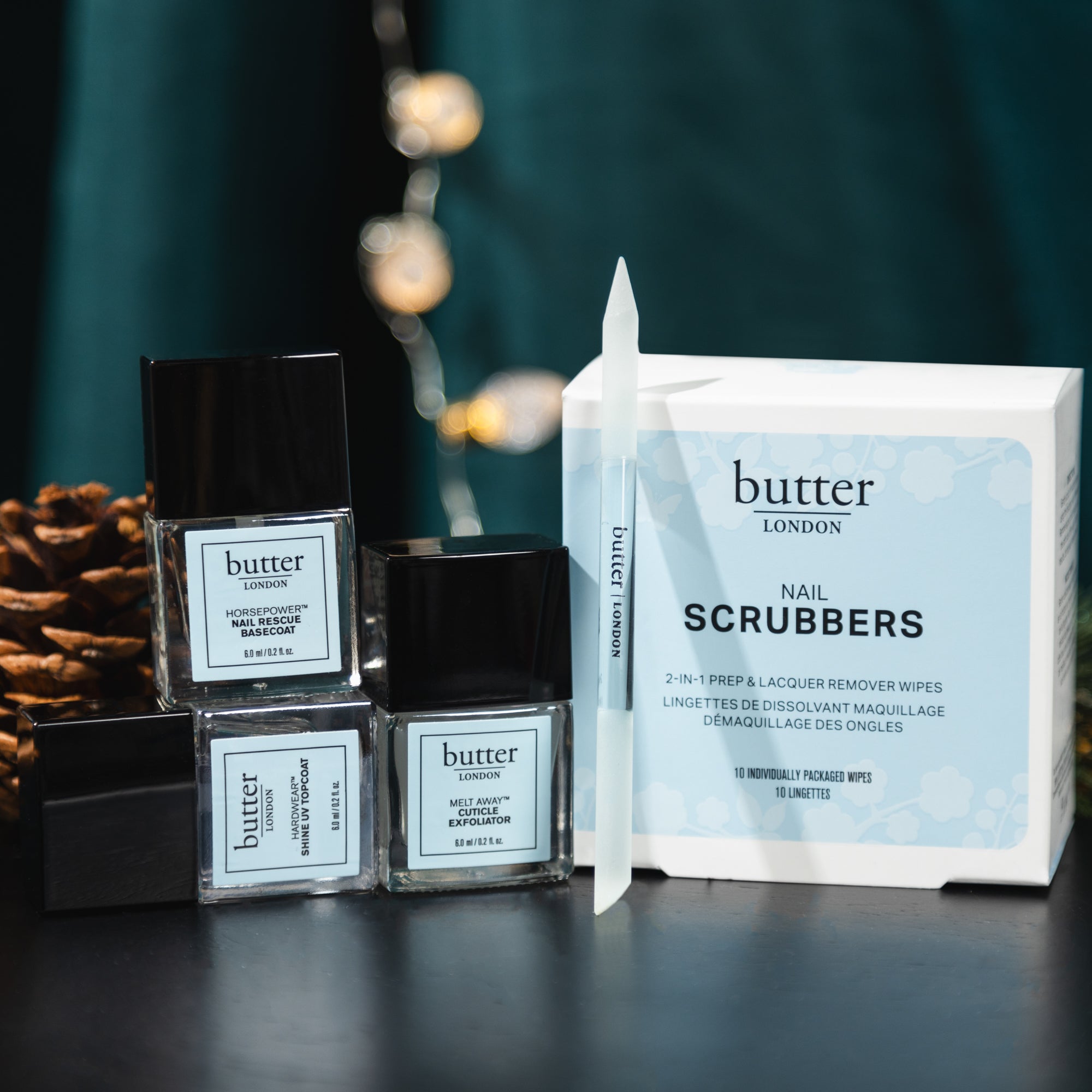 Butter London nail polish bottles and nail care products displayed with a box reading NAIL SCRUBBERS