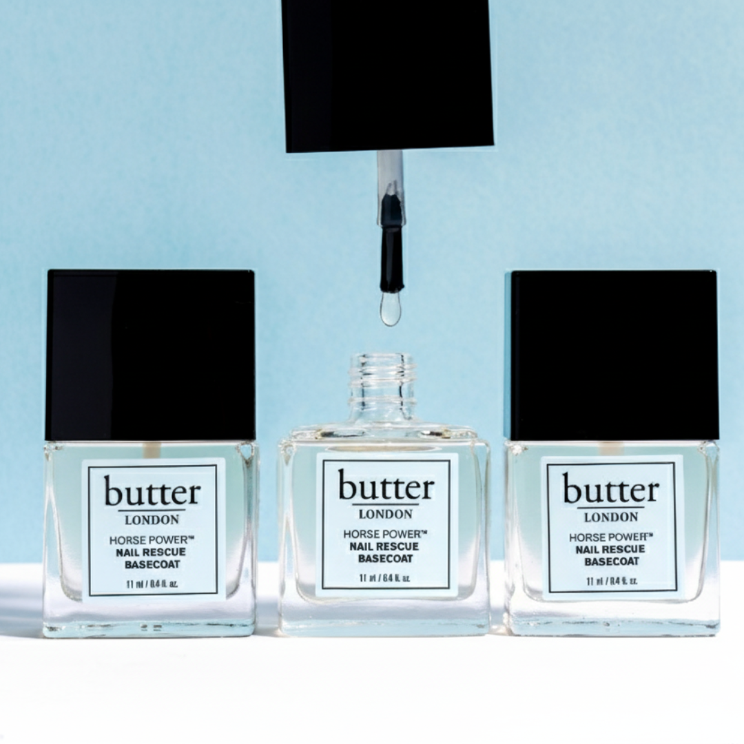 Butter London Horse Power Nail Rescue Basecoat bottles lined up against a light blue backdrop.