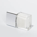 PS10X in Cotton Buds - White nail polish  bottle laying on its side against white background