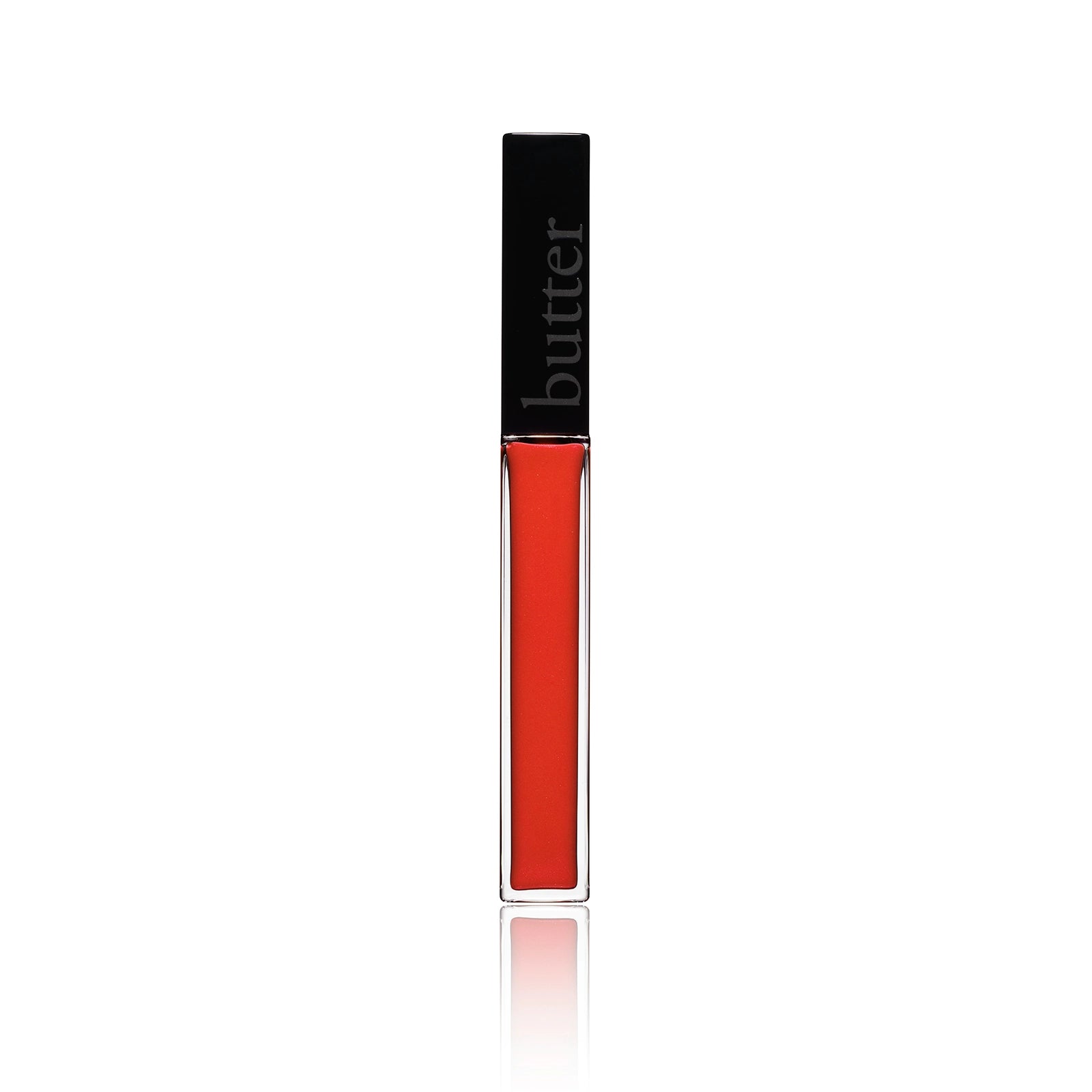 Lip gloss tube with black cap and bright orange red gloss