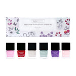 Butter London Spring Candy six piece nail lacquer set displayed with pastel bottles in front of a floral patterned box.