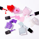 Butter London Spring Candy 6 piece Pure Colour nail lacquer set with red pink lavender purple and pastel shades on a white surface