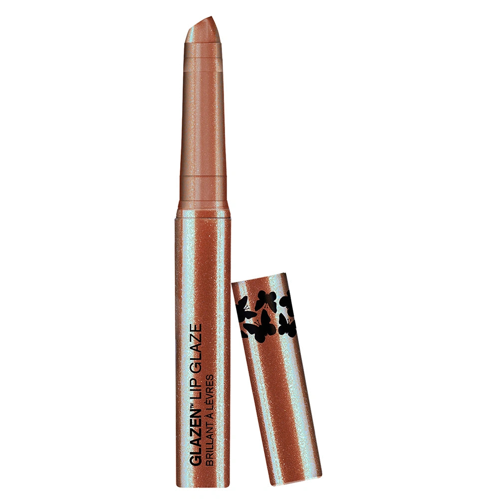 Magic Dust Lip Glaze - Open silo with product cap leaning against it on white background